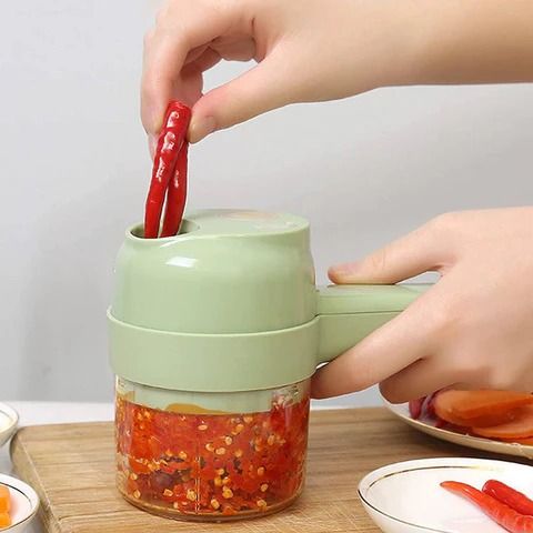 Rechargeable 4 In 1 Electric Vegetable Cutter With Multi-Function Slicer, Chopper, Grinder And Peeler For Fast Kitchen Preparation (Random Color) View Gallery - Pakistan