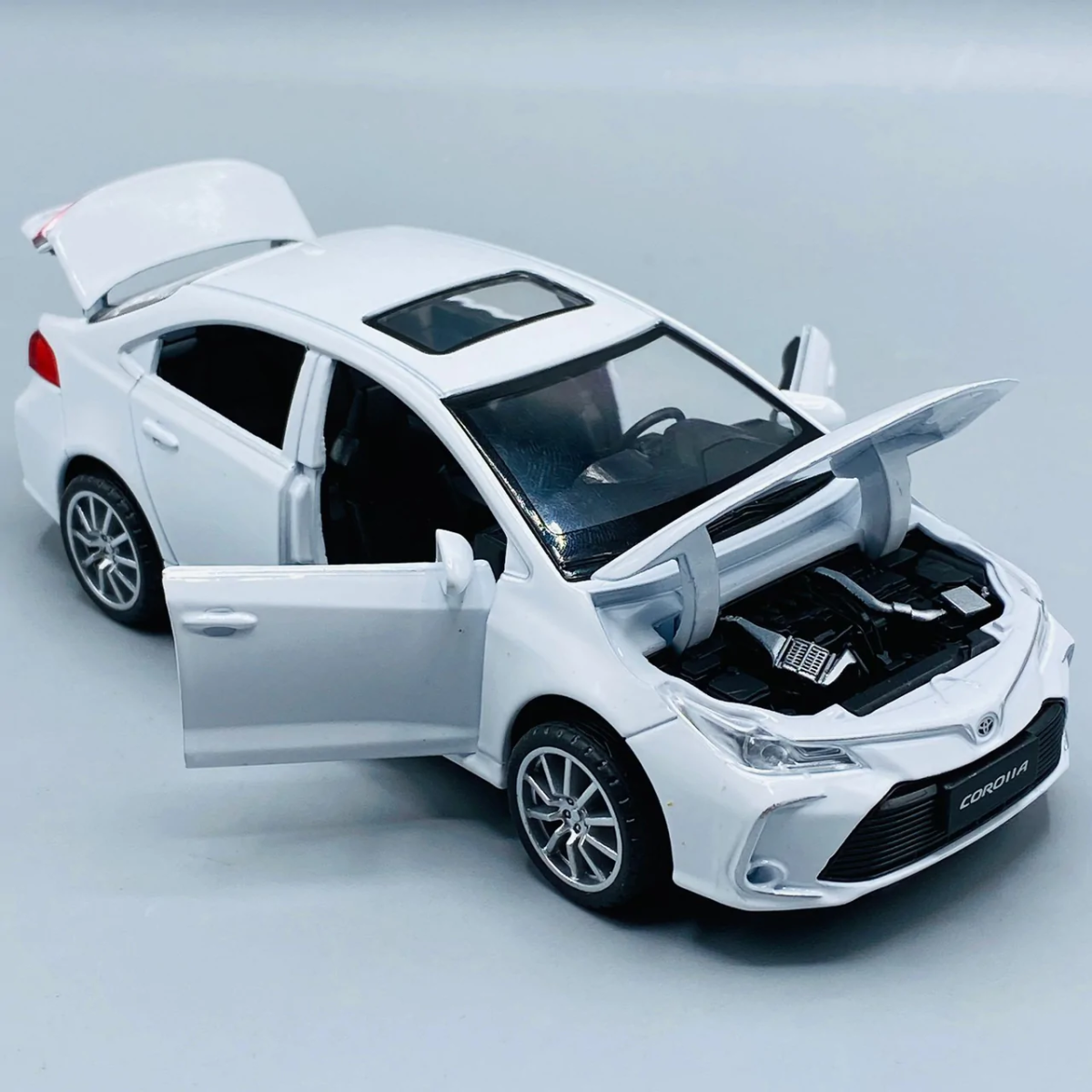 Corolla Toy Car with Smart Sensor Touch High-Quality Kids Toy Vehicle (Random Colors Available) View Gallery - Pakistan