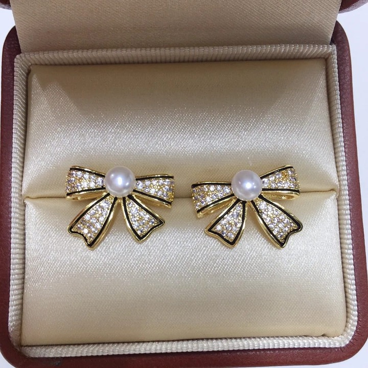 PJT-995 Bow Shape Zircon Pearl Earrings for Women – Korean Style Jewelry with Sparkling Zircon &amp; Classic Pearl Center | Available in Golden &amp; Silver | Perfect Gift for Parties, Weddings &amp; Everyday Fashion View Gallery - Pakistan