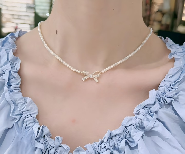 PQT-992 - Bow Shape Pearl Pendant Necklace for Women – Dainty Jewelry with Sparkling Bow Design | Available in Silver &amp; Golden Finish | Perfect Gift for Weddings, Parties &amp; Everyday Glamour View Gallery - Pakistan