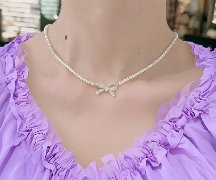 PQT-992 - Bow Shape Pearl Pendant Necklace for Women – Dainty Jewelry with Sparkling Bow Design | Available in Silver &amp; Golden Finish | Perfect Gift for Weddings, Parties &amp; Everyday Glamour View Gallery - Pakistan