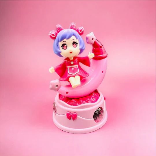 Rotating Moon Doll Toy With LED Lights &amp; Music – Adorable Crescent Moon Design, Universal Rotation, Safe for Kids 3+, Pink &amp; Purple Gift for Fun and Sensory Play (Random Color) View Gallery - Pakistan