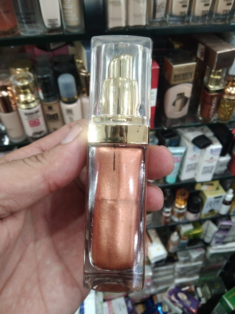 Huda Beauty N.Y.M.P.H. All Over Body Highlighter – Liquid Illuminator for Face, Body &amp; Legs – Water-Based, Long-Lasting Glow – 35 ml View Gallery - Pakistan
