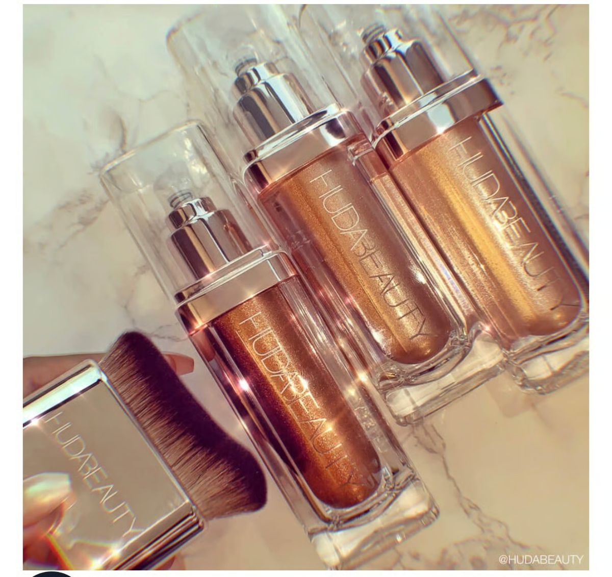 Huda Beauty N.Y.M.P.H. All Over Body Highlighter – Liquid Illuminator for Face, Body &amp; Legs – Water-Based, Long-Lasting Glow – 35 ml View Gallery - Pakistan
