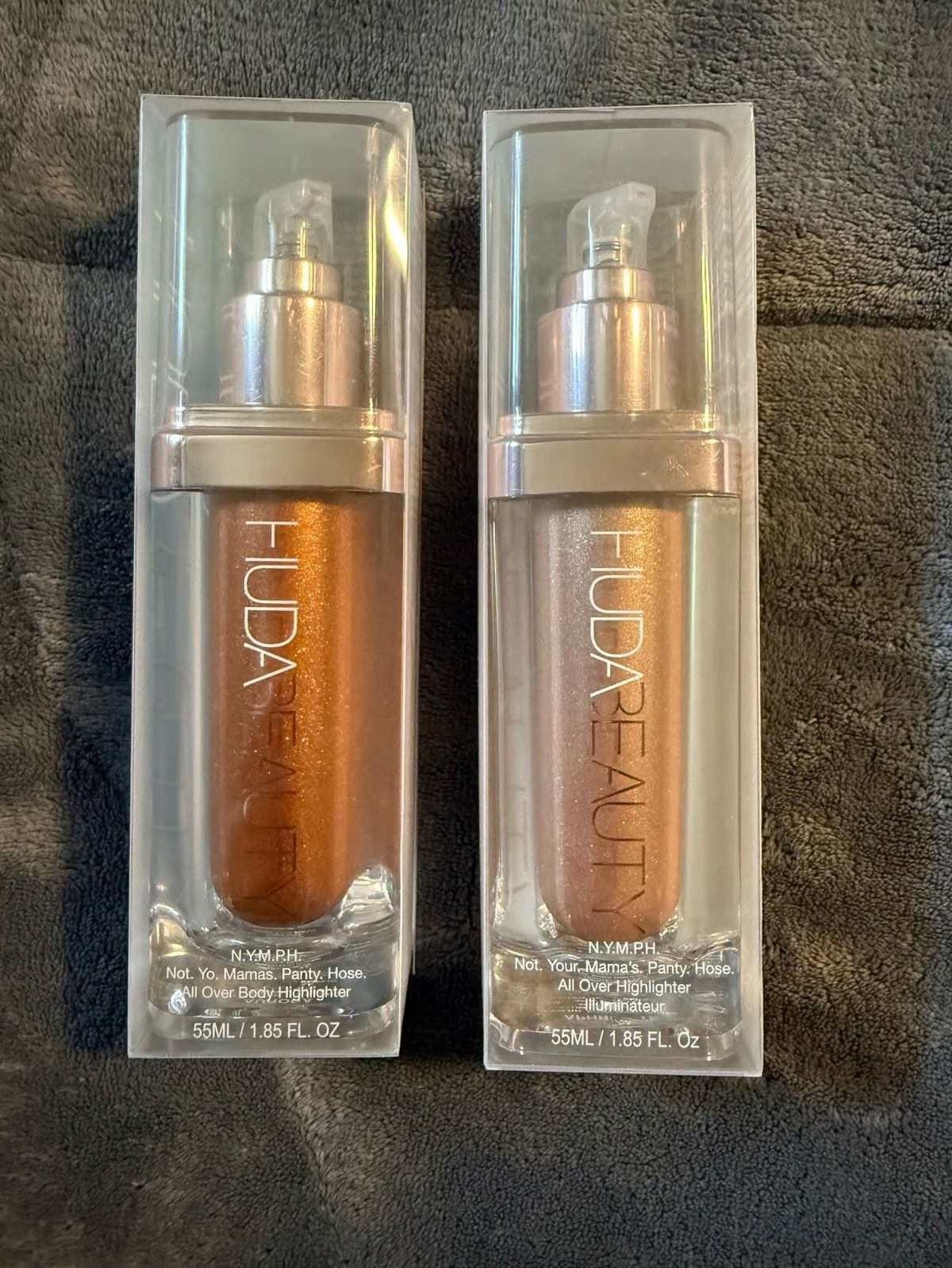 Huda Beauty N.Y.M.P.H. All Over Body Highlighter – Liquid Illuminator for Face, Body &amp; Legs – Water-Based, Long-Lasting Glow – 35 ml View Gallery - Pakistan