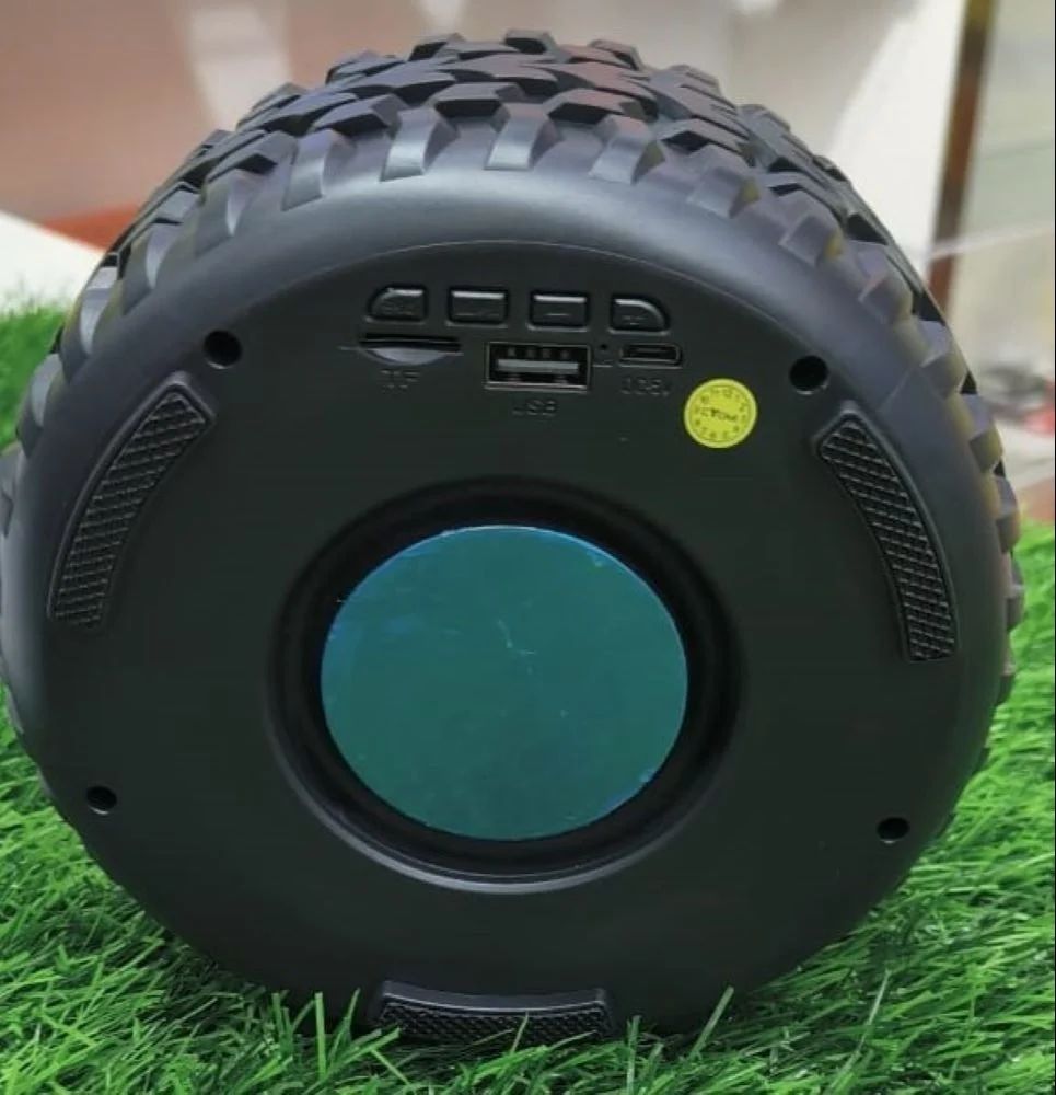 High-Powered Tyre-Shaped Bluetooth Speaker with Deep Extra Bass – Portable Wireless Speaker with Dynamic Sound, LED Lights &amp; Unique Tyre Design for Home, Car, and Outdoor Use View Gallery - Pakistan