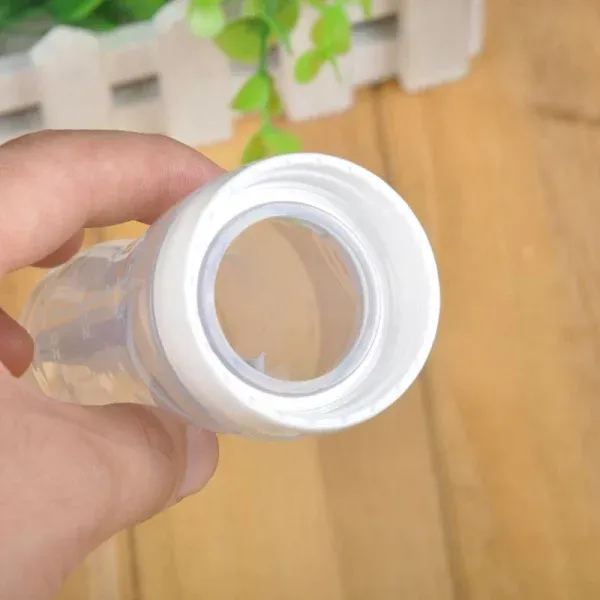 Silicone Bottle Feeding Baby Spoon Feeder - Best Quality Spoon Feeder - Random Color View Gallery - Pakistan