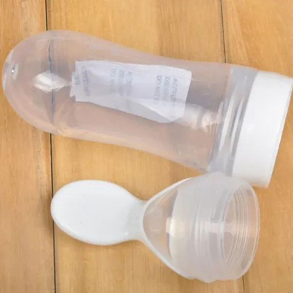Silicone Bottle Feeding Baby Spoon Feeder - Best Quality Spoon Feeder - Random Color View Gallery - Pakistan