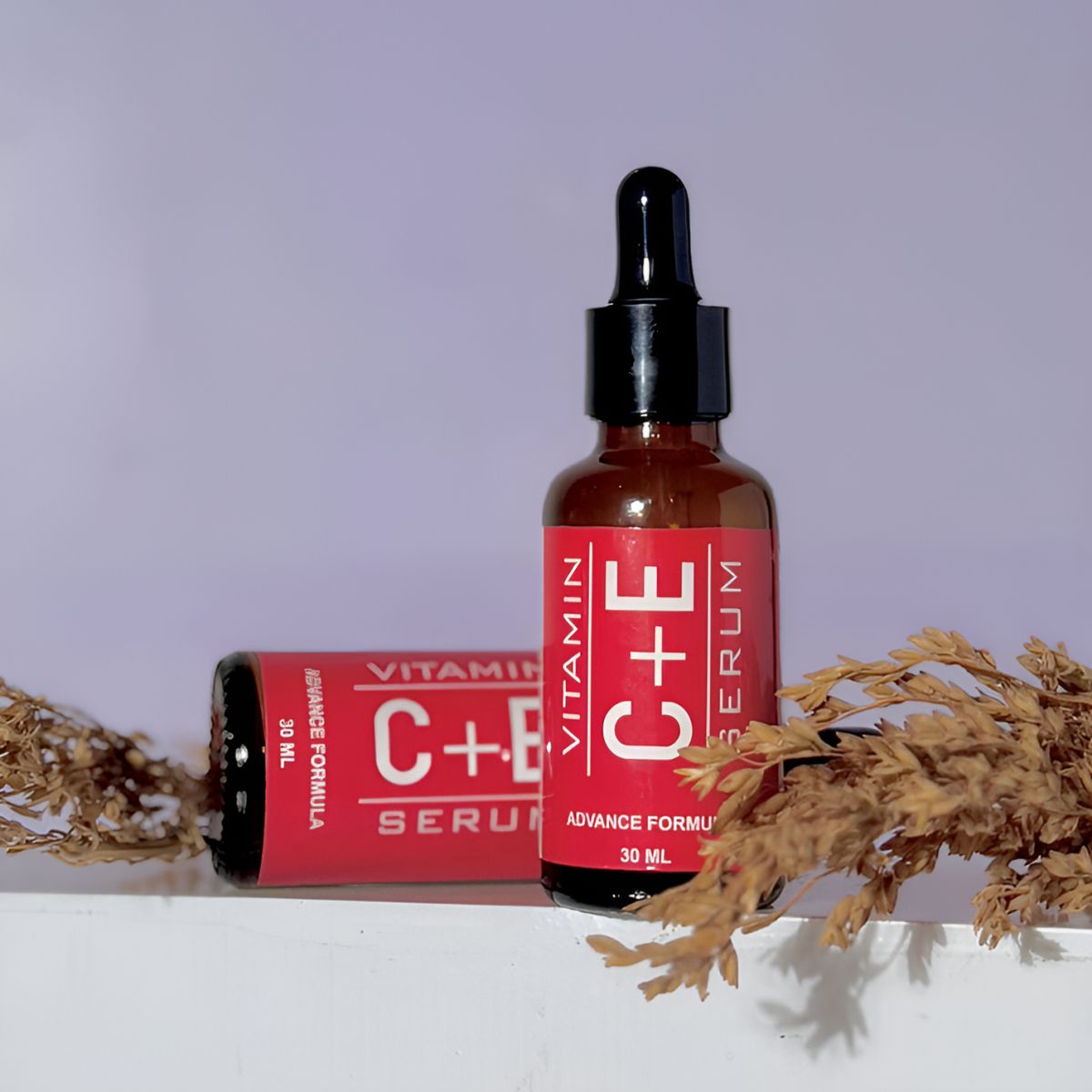 Nirvana Botanics Vitamin C + E Serum - 15ml | ANTI ACNE &amp; GLOWING SERUM VITAMIN C + E View Gallery - Pakistan