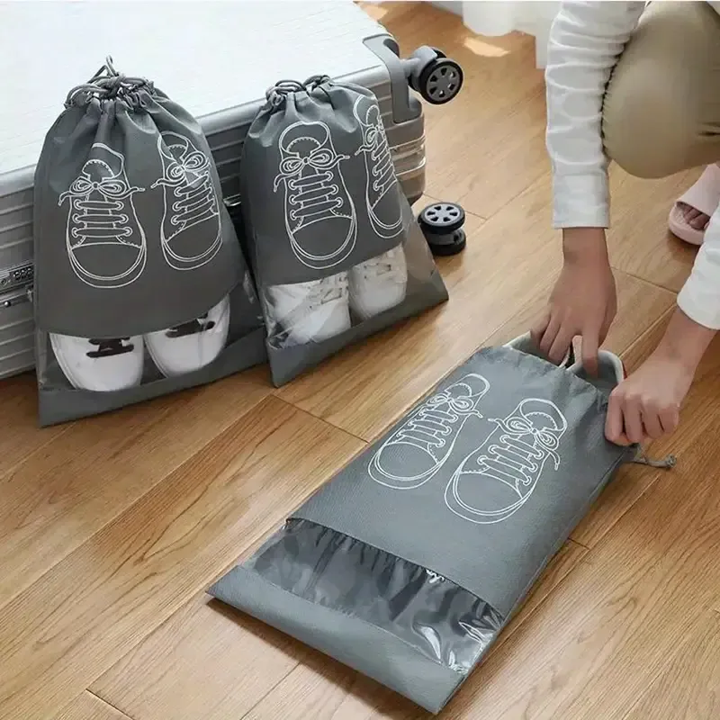 Pack of 01 - Shoe Bag for Travel &amp; Home Storage – Dustproof Printed Shoe Organizer Pouch in Random Gray – Lightweight, Breathable, and Reusable Shoe Cover for Luggage, Closet, or Gym Use - Grey Color View Gallery - Pakistan