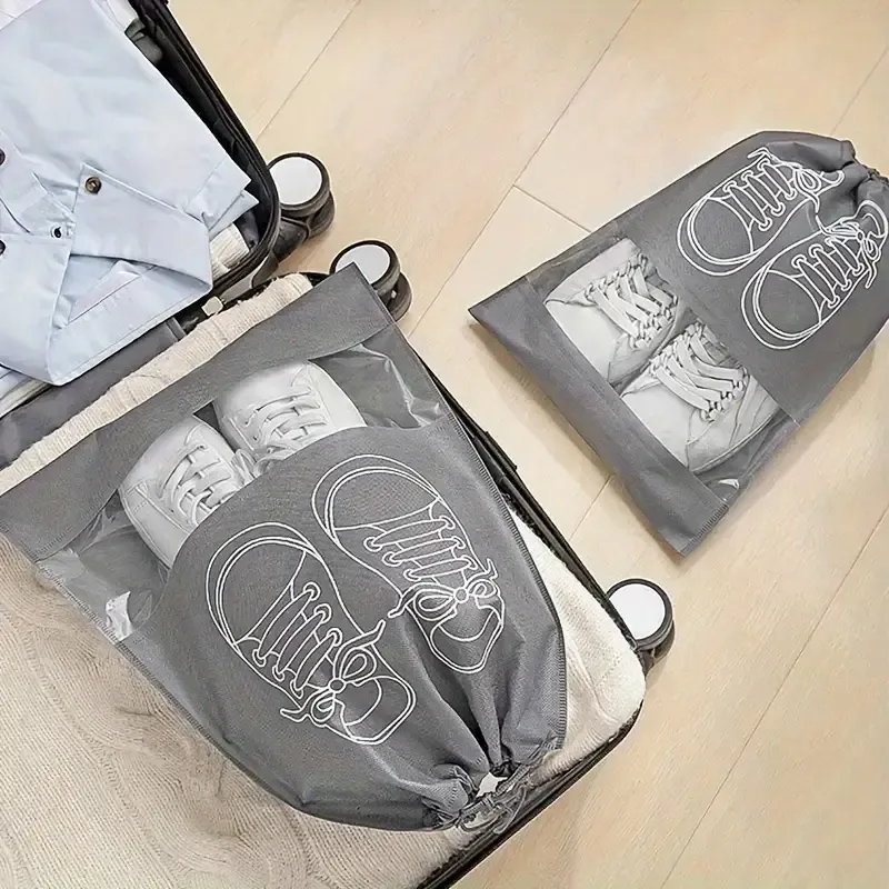 Pack of 01 - Shoe Bag for Travel &amp; Home Storage – Dustproof Printed Shoe Organizer Pouch in Random Gray – Lightweight, Breathable, and Reusable Shoe Cover for Luggage, Closet, or Gym Use - Grey Color View Gallery - Pakistan