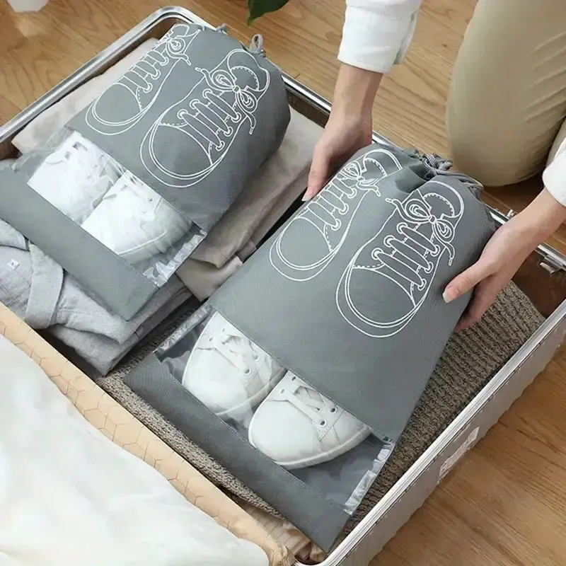 Pack of 01 - Shoe Bag for Travel &amp; Home Storage – Dustproof Printed Shoe Organizer Pouch in Random Gray – Lightweight, Breathable, and Reusable Shoe Cover for Luggage, Closet, or Gym Use - Grey Color View Gallery - Pakistan