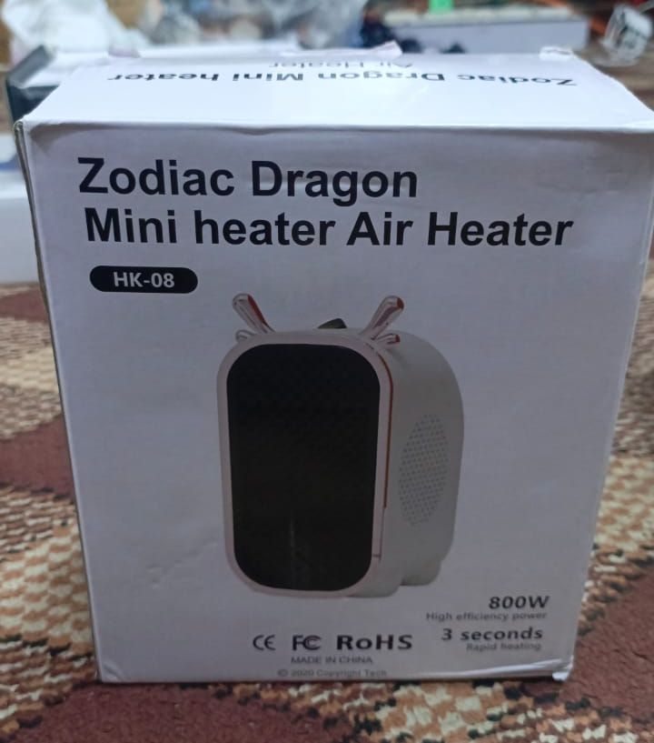 Zodiac Dragon Mini Portable Electric Desk Air Heater for Room, Small Tabletop Fan - 800W (Random color) View Gallery - Pakistan