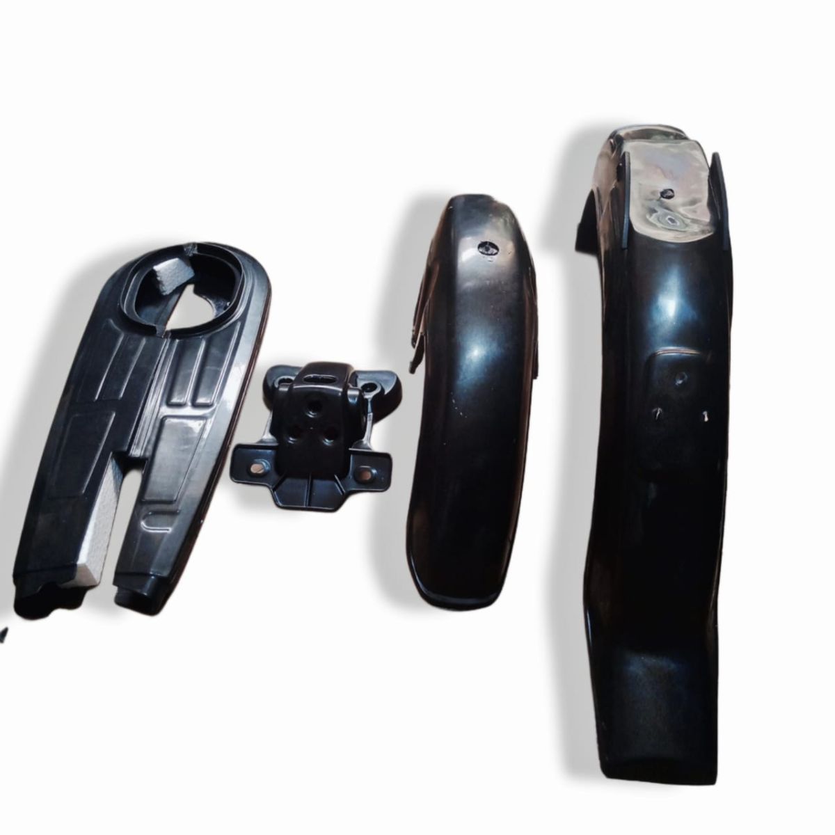 (Pack of 4) Unbreakable Plastic mudguards set plus chain cover and back light stand  for all 70cc bikes View Gallery - Pakistan