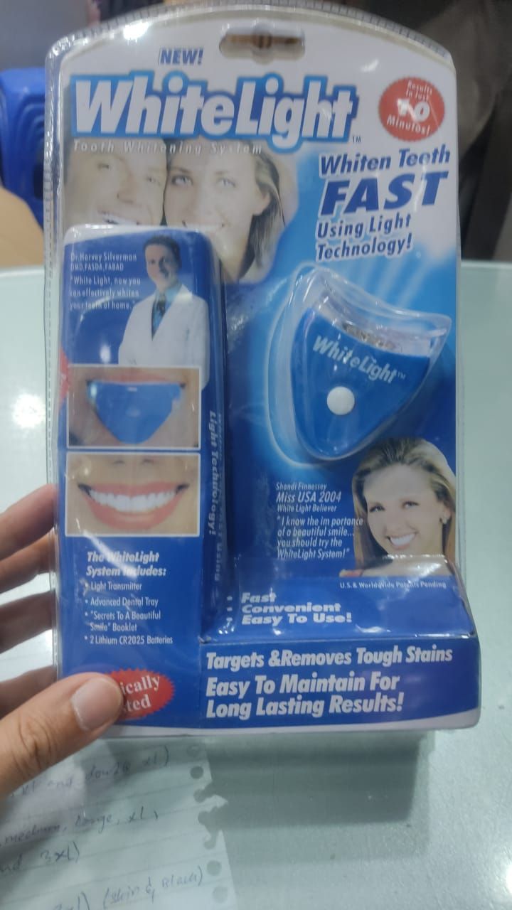 White Light Teeth Whitening Brightener | No box card packing  and cell operated. View Gallery - Pakistan