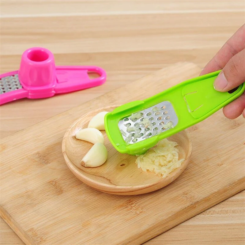 Garlic Press Grater Slicer Plastic Grinding Tool Kitchen Accessories(random color ) View Gallery - Pakistan