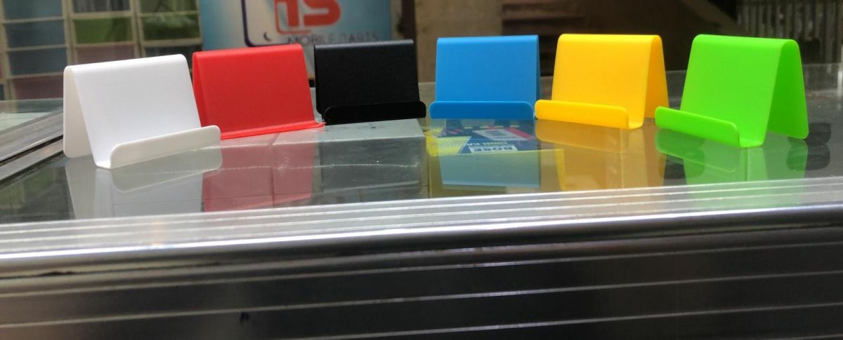 1Pc Cell Phone Stand For Desk (Random Colour) View Gallery - Pakistan
